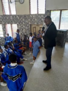 picture of Okechukwu Onye and students of Dority International Secondary School