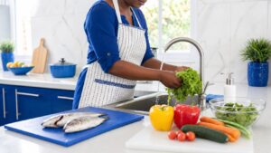 Safe preparation of fresh vegetables in a clean Nigerian kitchen