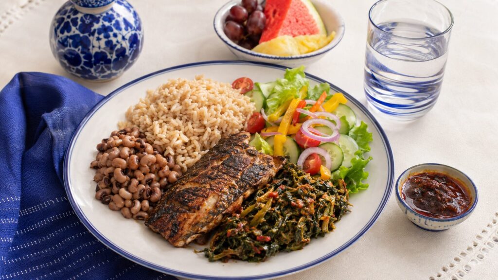 A balanced Nigerian meal with vegetables, grains and protein