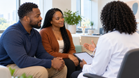 Black couple in a fertility consultation, doctor seen from behind